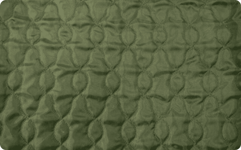 Green satin quilted in a leaf pattern