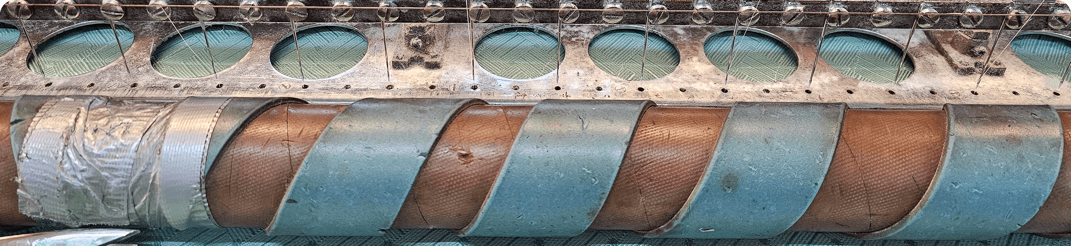 Quilted fibreglass wrapped around a roller on the quilting machine