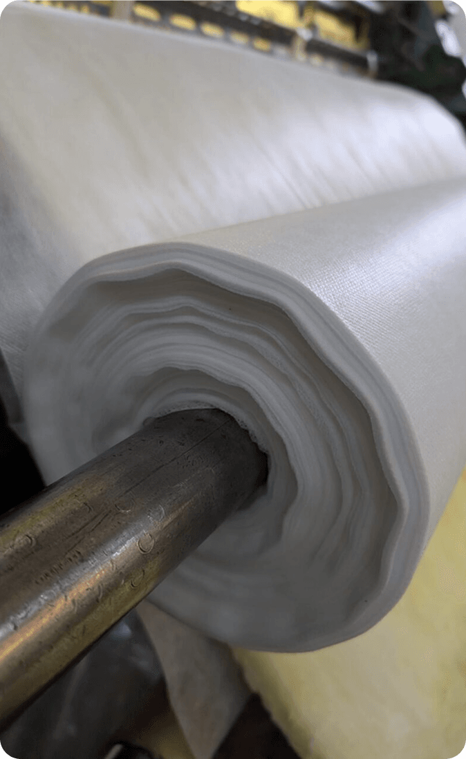 A roll of quilted fibreglass on the machine