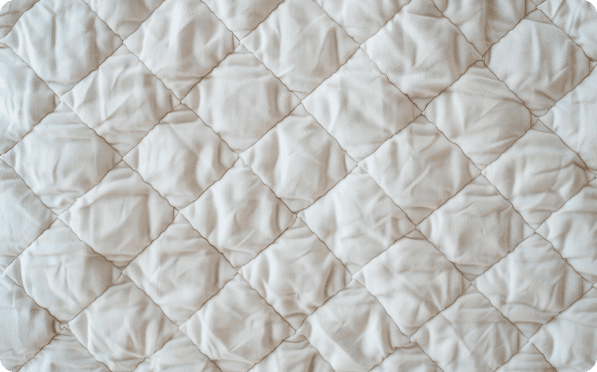 Cream fabric quilted in a diamond pattern