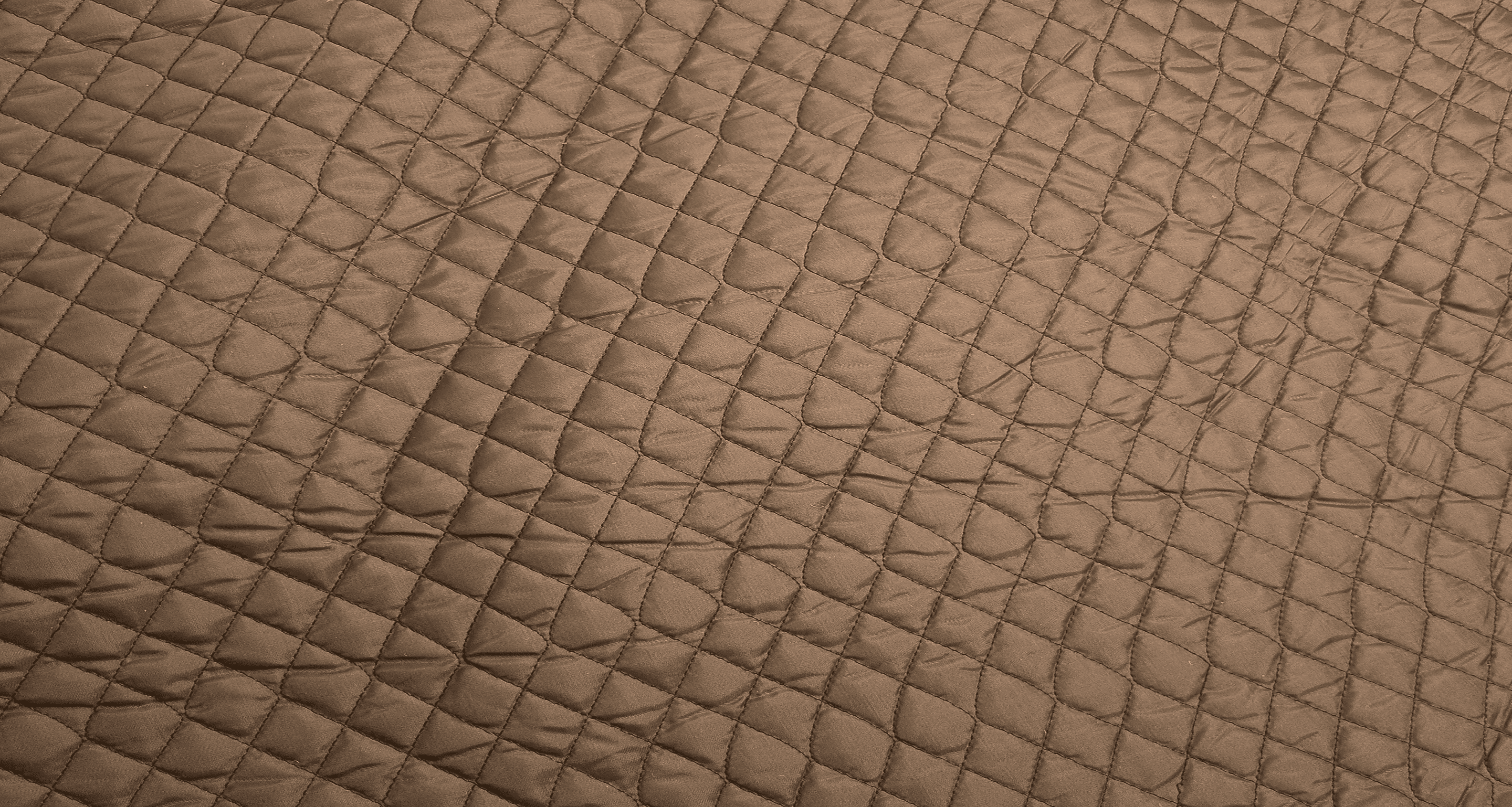 Brown fabric quilted in a fine diamond pattern
