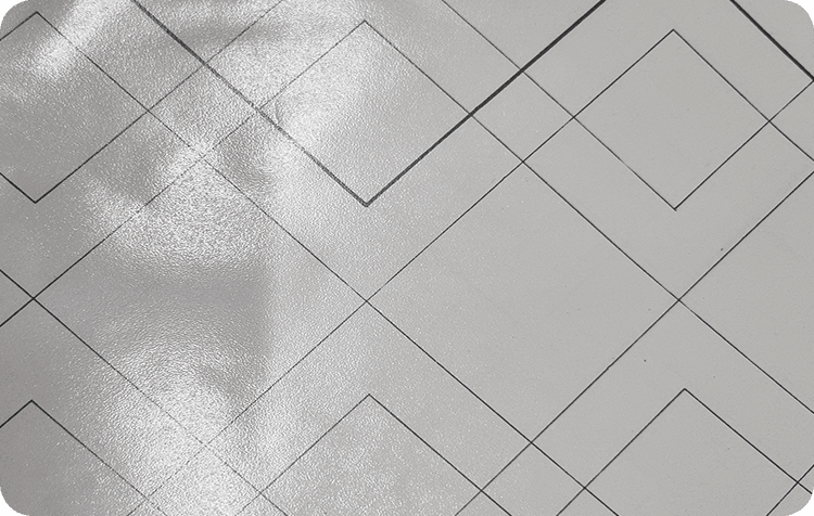 Close-up of pale grey diamond-quilted technical fabric