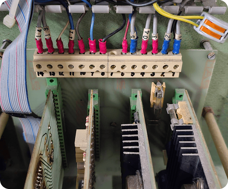 An electronics panel with wired terminal blocks on the quilting machine